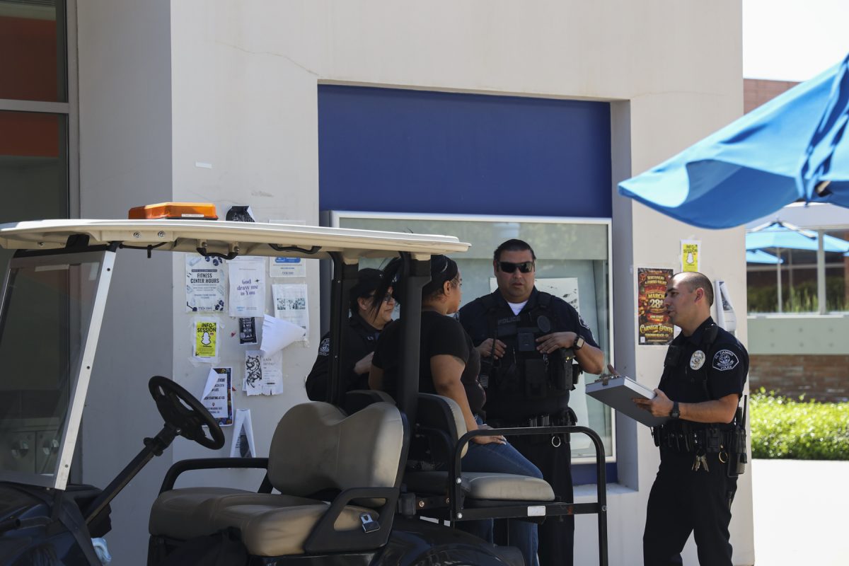 Police officers taking a statement from the student that caused a disturbance. Photography major, 20, Samantha Cetina said the individual was "being very aggressive." Eleni Klostrakis|The Union