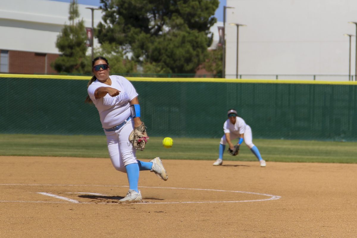 El Camino College pitcher Estrella Tapia winds up her pitch against opponents Long Beach City College Vikings on Tuesday, March 24 at the ECC softball field. (Frances Que | The Union).