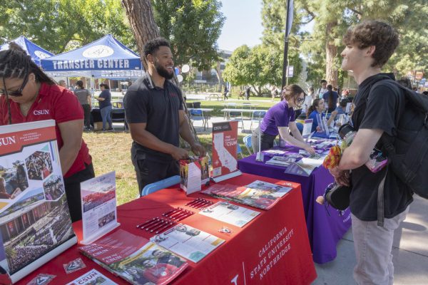 Outreach council member Branden Smith breaks down the college life that transfer students would experience at California State University, Northridge on Thursday, March 19, during the Transfer University Fair. Over 62 students successfully transferred and enrolled at CSUN during last semester's Transfer Fair.