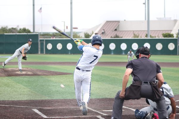 El Camino College Warriors infielder Slater Nunez hits a follow-through swing at the plate during the Warriors' home game against Cerritos College Falcons at Warrior Field Thursday, April 9. Nunez is an ECC sophomore from Torrance who attended Torrance High School. (Brande Mathews | The Union)