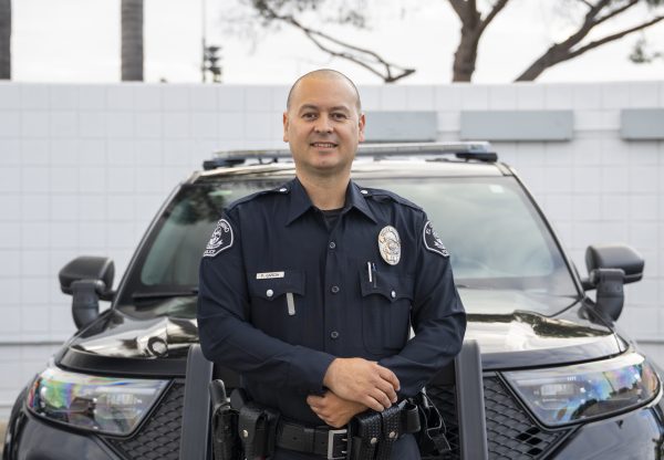 Officer Pablo Garcia, 44, stands beside a patrol vehicle outside the El Camino College Police Department. (Gael Gallardo | The Union)