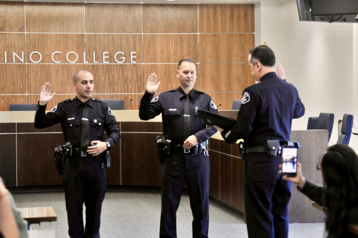 (L-R) Officers Ryan Brown and Pablo Garcia are sworn in to the El Camino College police force by Chief of Police Matthew Vander Horck at the Kenneth A. Brown Boardroom of the Administration Building on Thursday, April 2.  (Riley Abrams | The Union)