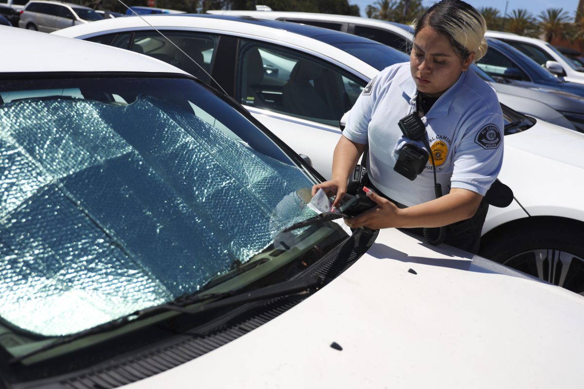 Cadet Teresa Hurtado issuing a parking ticket on Wednesday, April 22. (Eleni Klostrakis|The Union)