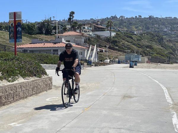 A man rides his bicycle along the Marvin Braude Bike Trail at Torrance Beach Wednesday, April 15. (Erica Lee | The Union)