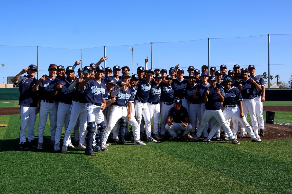 The Warriors pose in the center of the El Camino College baseball field with pride and smiles after a winning victory against the Pasadena City College Lancers, Friday, April 24. (Patrick Martinez | The Union).