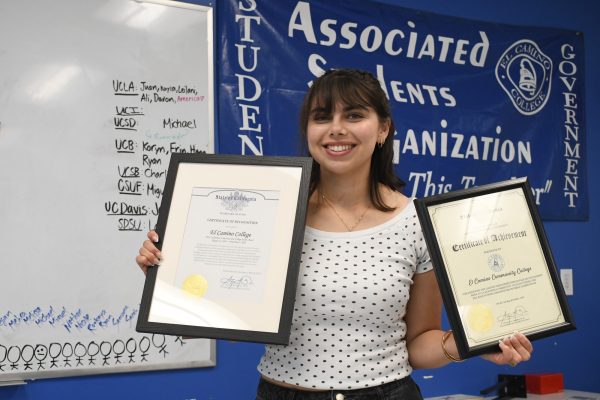 Associated Students Organization Director of External Affairs Jocelyn Coemans, 21, holds up the California secretary of state certificates awarded to El Camino College for their achievements in a statewide competition engaging student voters during the 2021 and 2024 primary elections. This year, Coemans hosted nine outreach events to register student voters and create voting plans, leading the college to rank first among California community colleges and second in the state overall among all colleges and universities. (Nikki Yunker | The Union)