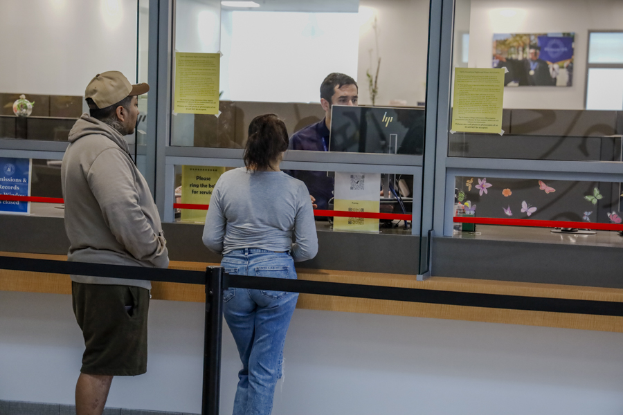 People talk to El Camino employees about admission plans for the upcoming semester in the El Camino Student Services building on May. 21. (Donovan Harris | The Union) Photo credit: Donovan Harris